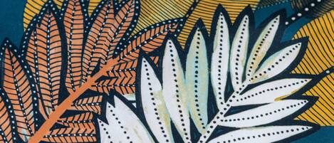 A close-up of a patterned fabric with leaf designs.