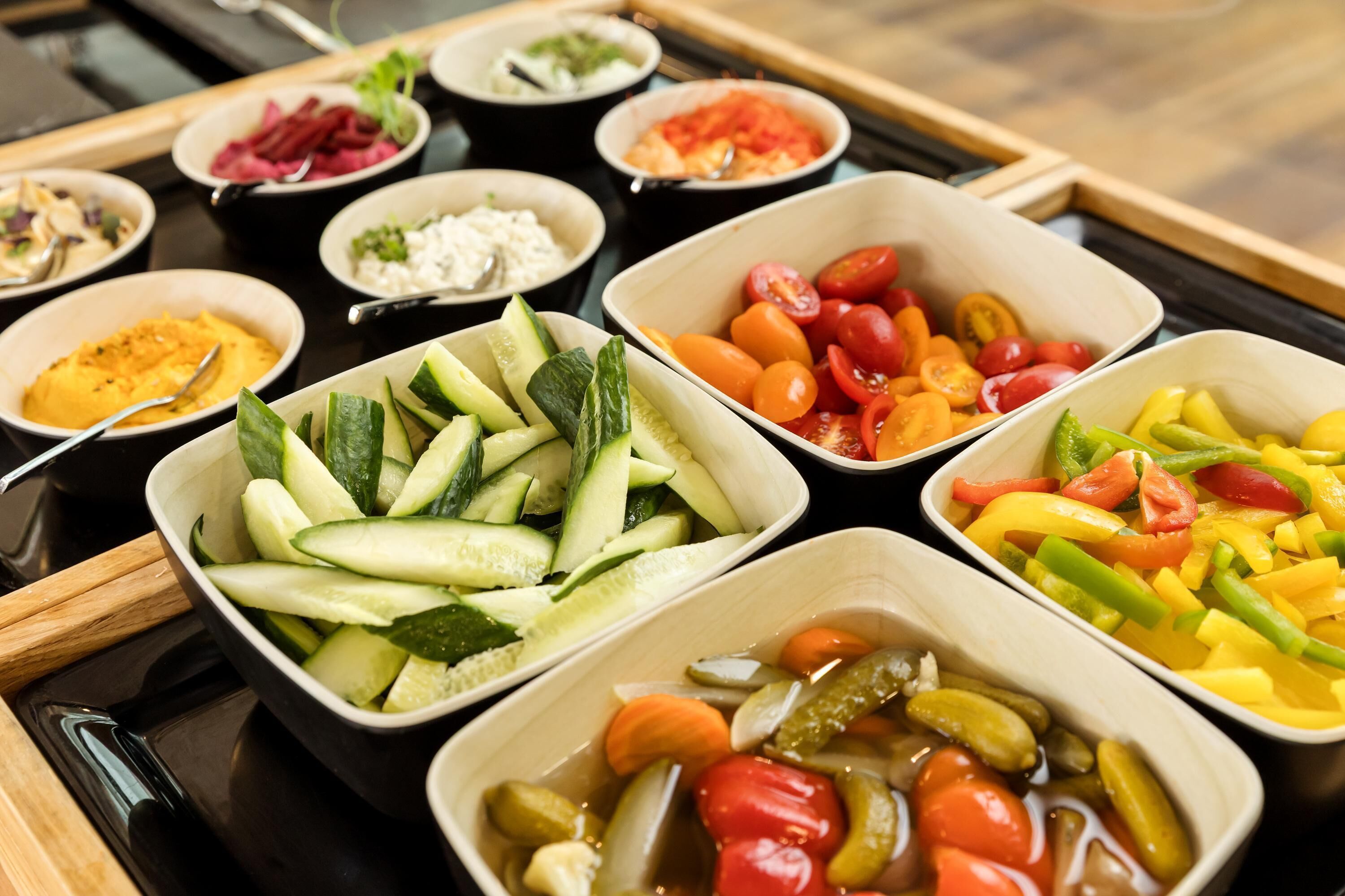 A variety of food items arranged in bowls on a table.