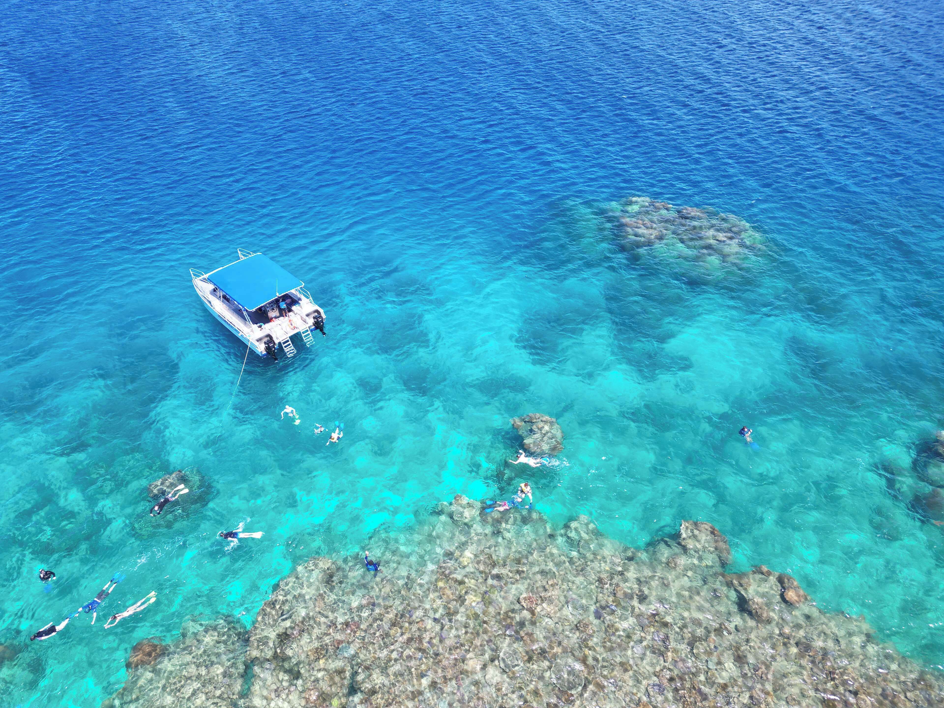 on the beach, sun-loungers, beach umbrellas, beach towels