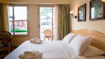 Classic Room, Pool View | Down duvets, minibar, in-room safe, desk