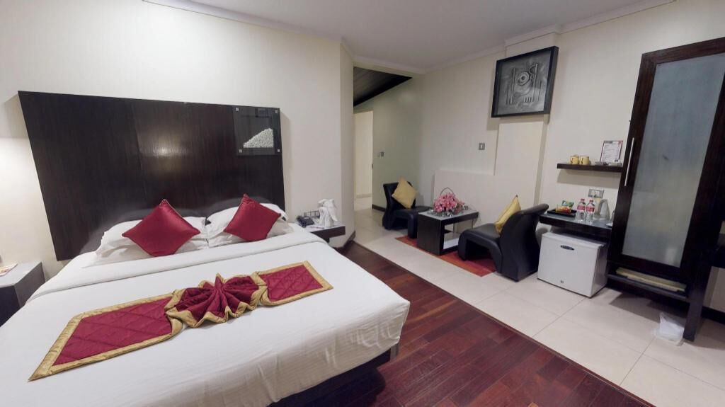 Egyptian cotton sheets, down comforters, Select Comfort beds, minibar