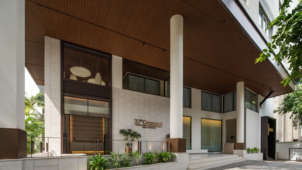 A modern building with a sign reading "37°Crescent Stay Revitalized". - 37th Crescent Hotel (Bengaluru)