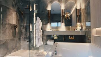 Executive Suite, 1 King Bed | Bathroom | Hair dryer, children's robes, heated floors, towels