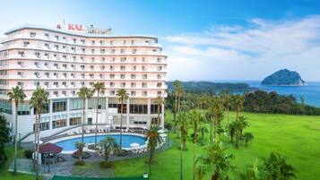 Experience the hotel's modern design with ocean views from every floor, set amidst a lush golf course and a serene pool area.