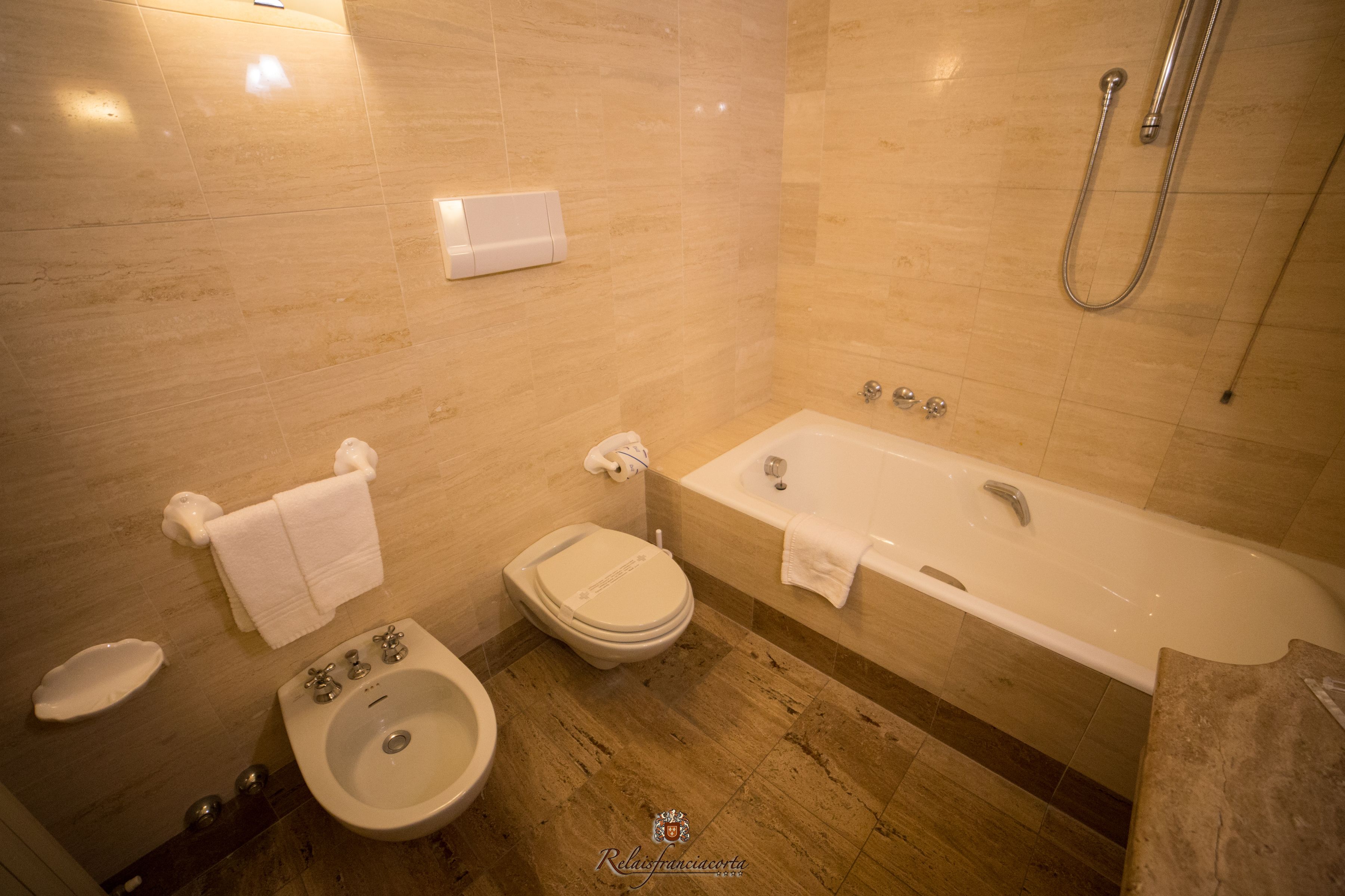 combined shower/bathtub, free toiletries, hair dryer, bathrobes