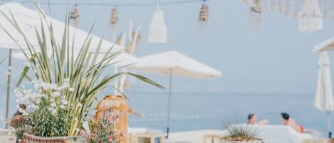 Sun loungers, beach umbrellas, beach towels