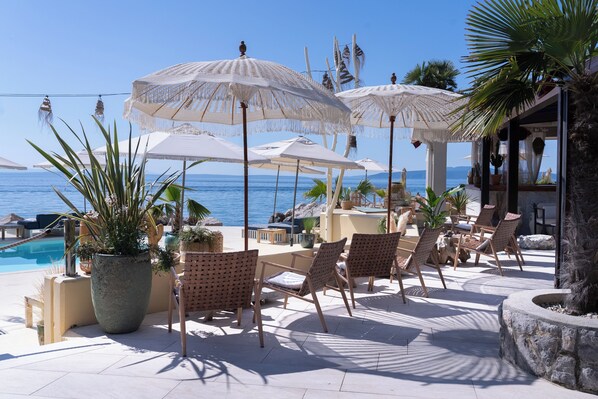 Sun-loungers, beach umbrellas, beach towels