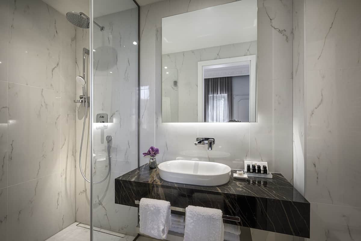 classic twin room | bathroom | free toiletries, hair dryer, bathrobes, slippers