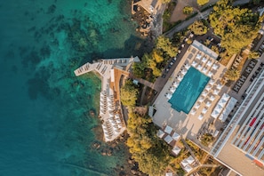 Indoor pool, seasonal outdoor pool, pool umbrellas, pool loungers