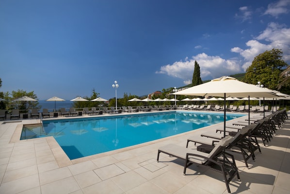 Indoor pool, seasonal outdoor pool, pool umbrellas, pool loungers