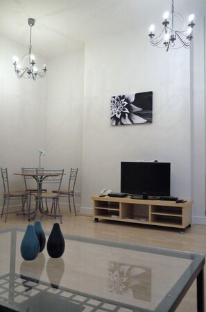 Apartment, 1 Bedroom | Living area | TV