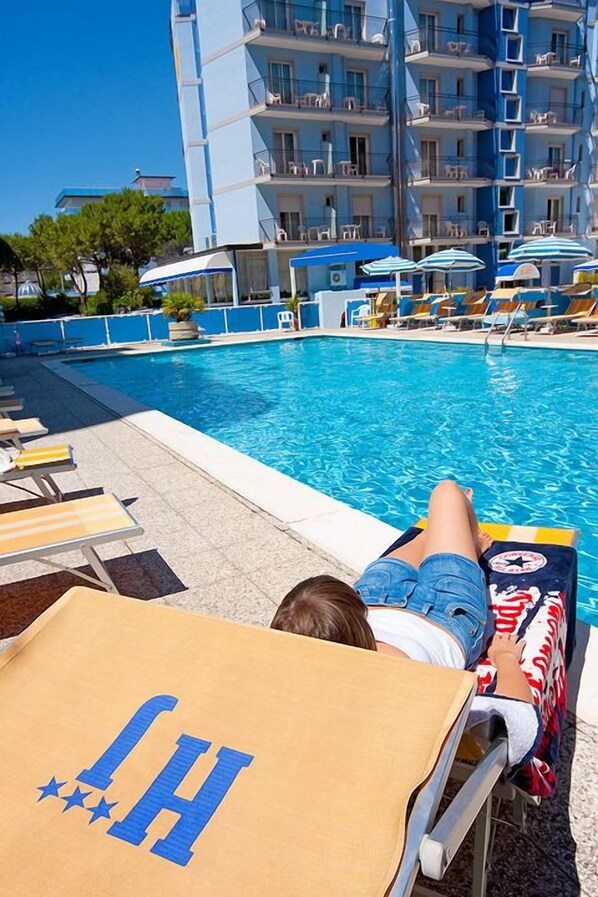 Seasonal outdoor pool, pool umbrellas, pool loungers