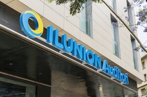 A building with a sign that reads "ILLUNION AUDITORI".