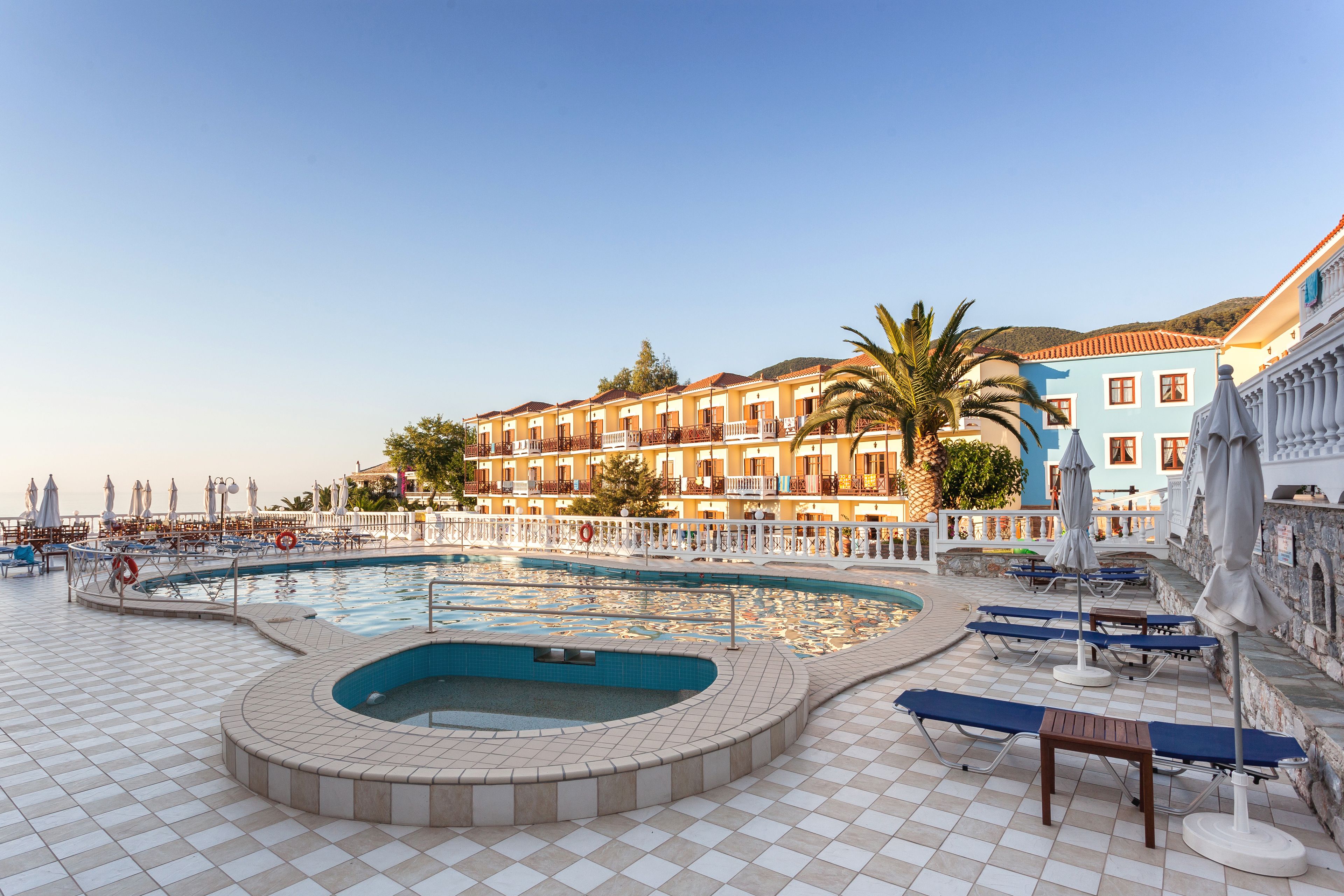 outdoor pool, pool umbrellas, pool loungers