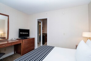 In-room safe, desk, laptop workspace, iron/ironing board - Sandman Hotels & Suites Calgary West (Calgary)