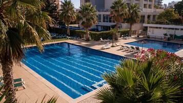 2 outdoor pools, open 9:00 AM to 8:00 PM, pool umbrellas, pool loungers