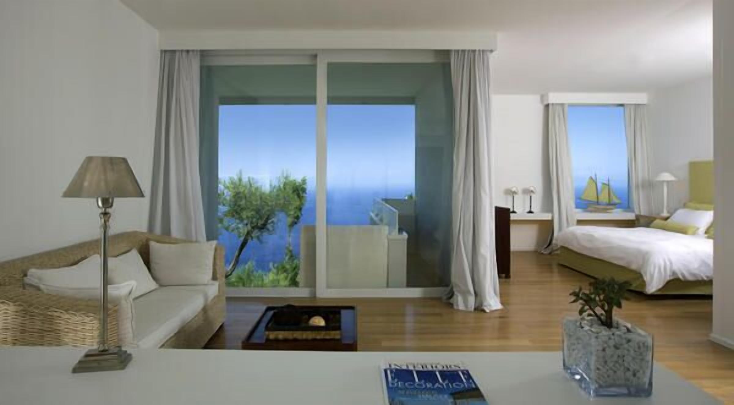 premium room | living area | flat-screen tv, pay films