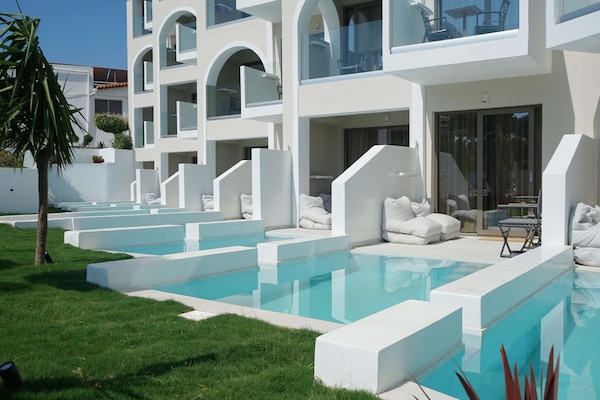 2 outdoor pools, open 9:00 AM to 6:00 PM, pool umbrellas, sun loungers