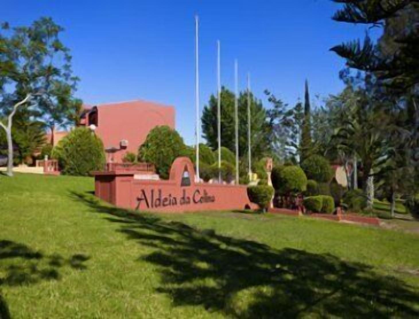 A building with a sign reading "Aldeia da Cima."