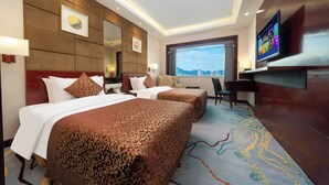 A hotel room with two beds, a large window, a flat-screen TV, and a city view. - Yanling Hotel (Guangzhou)