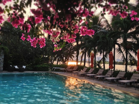 Outdoor pool, pool umbrellas, pool loungers. Saigon Domaine Luxury Residences