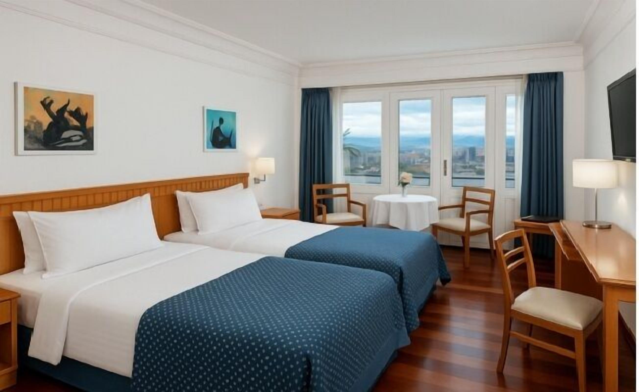 Standard Room, Multiple Beds | Egyptian cotton sheets, down comforters, minibar, in-room safe