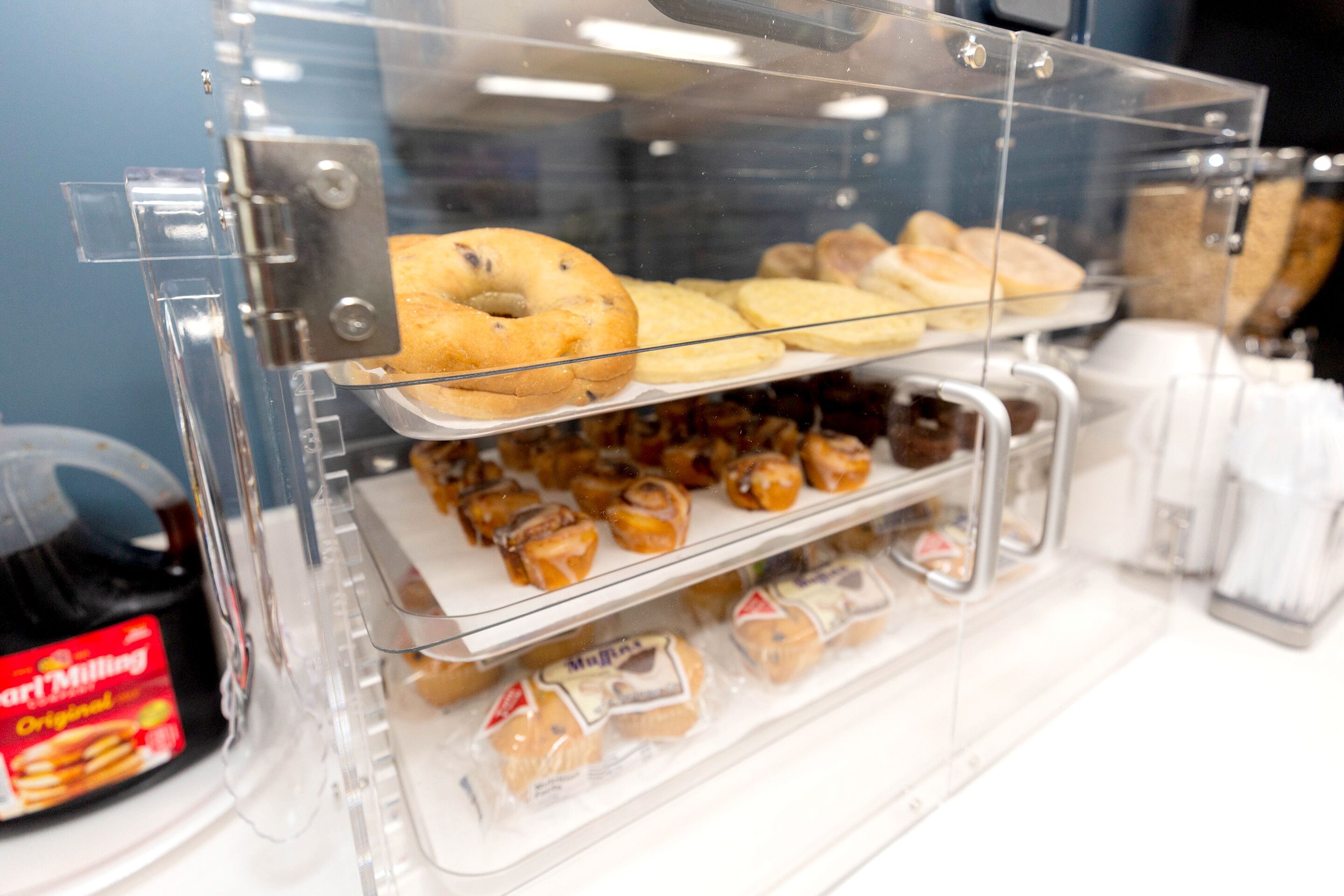 A bakery display case with various baked goods.