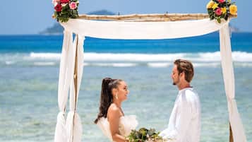 White sand, sun-loungers, beach umbrellas, beach towels