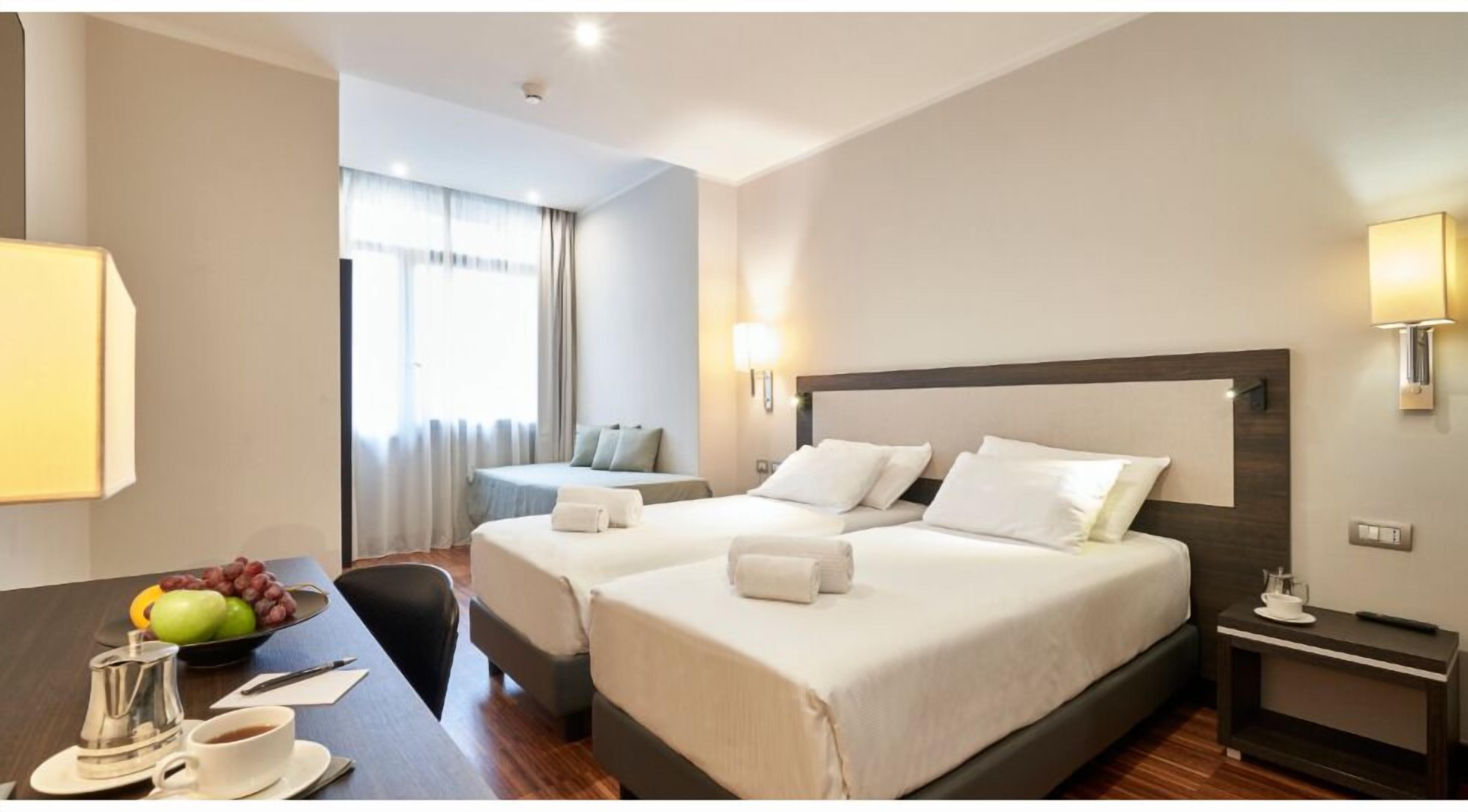 Deluxe Double or Twin Room | Minibar, in-room safe, desk, laptop workspace