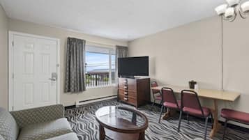 Suite, 1 Queen Bed, Kitchen | Living area | 50-inch LED TV with cable channels, TV