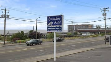 A motel sign with the name 'Riverfork Motel' and mentions 'Full Kitchen - Carlsberg T.V.' and 'Commercial Rates'.
