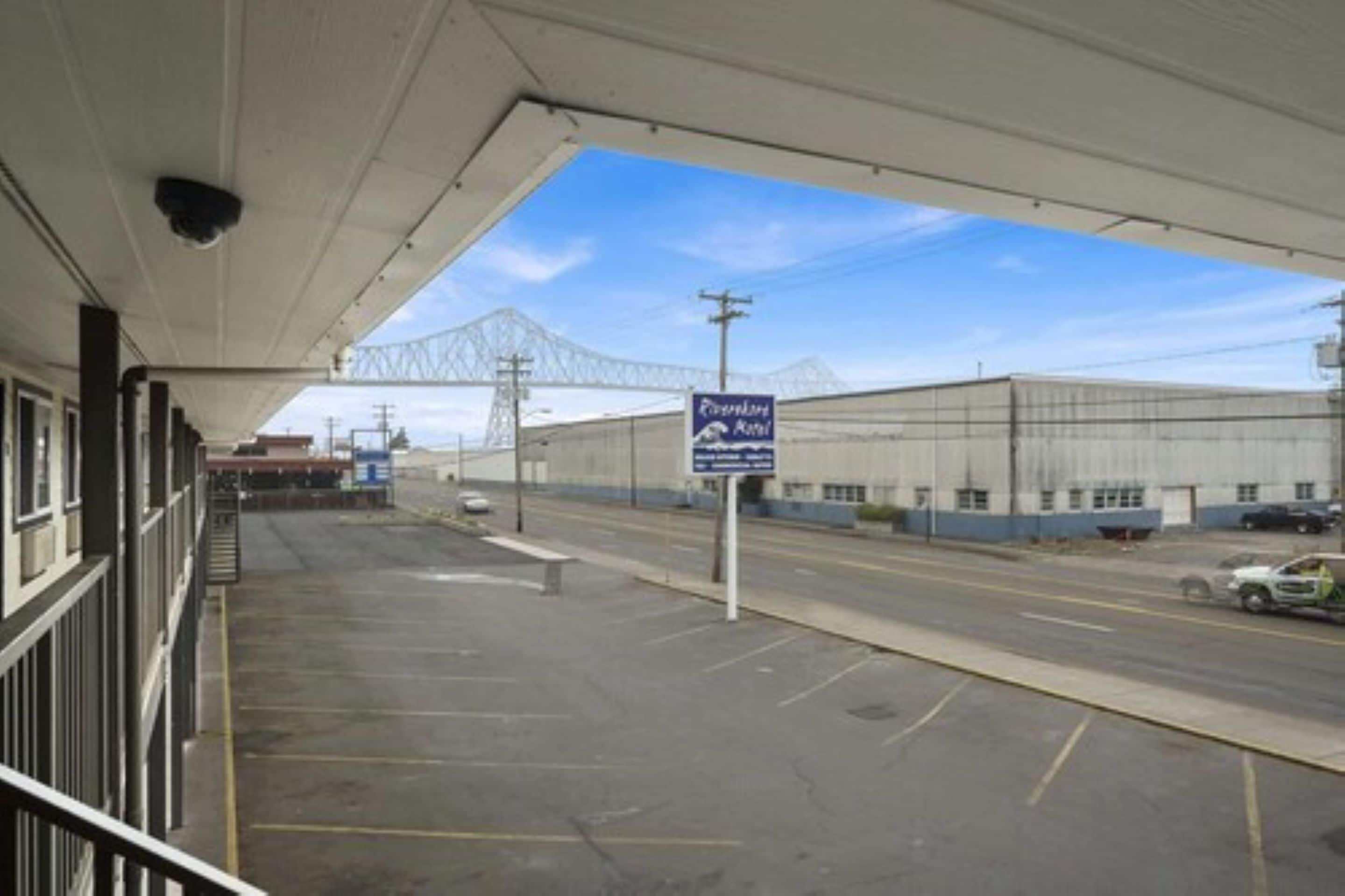 A parking lot with a sign for the "Pioneer Hotel."