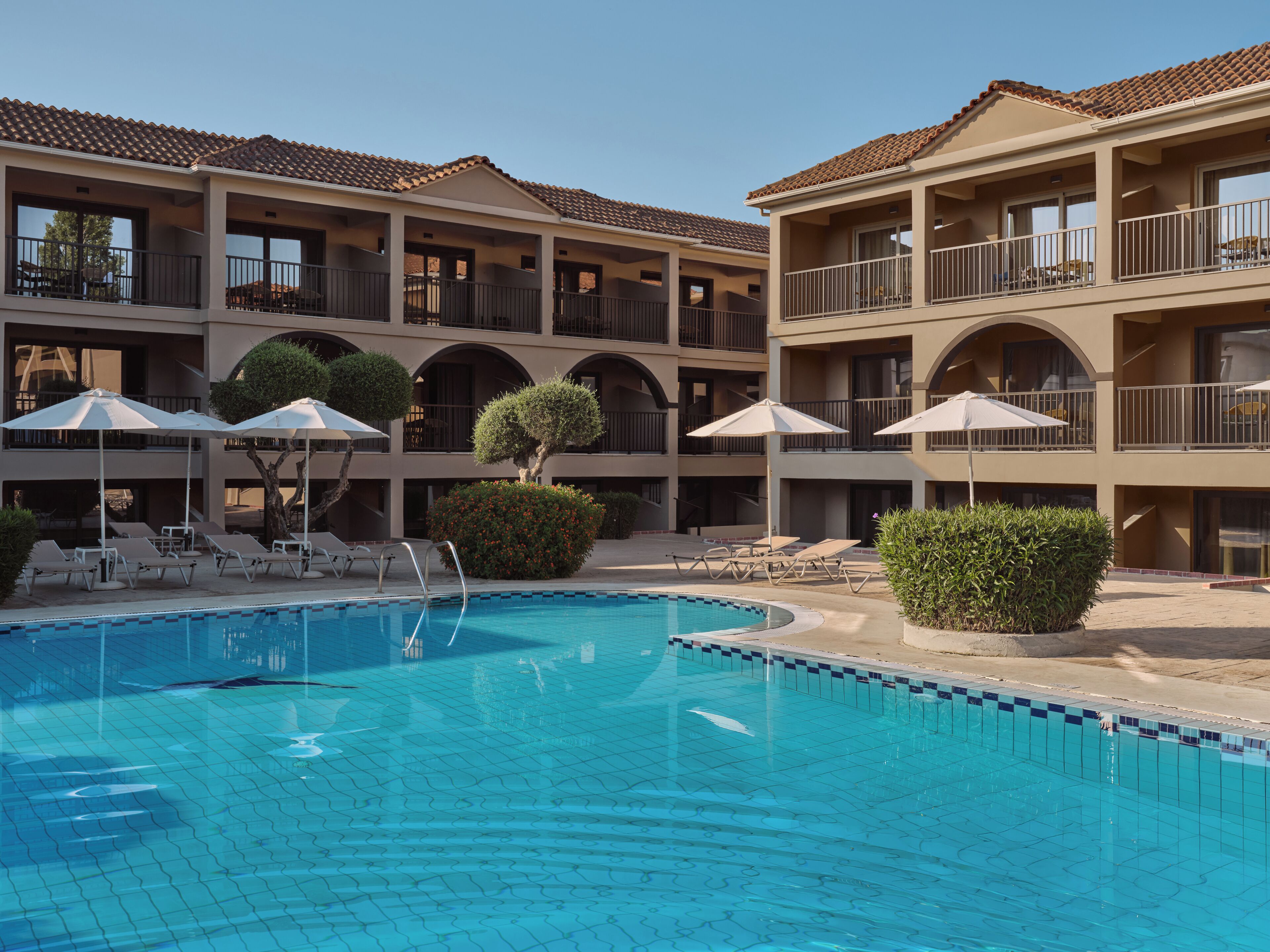 Seasonal outdoor pool, open 10:00 AM to 6:00 PM, pool umbrellas