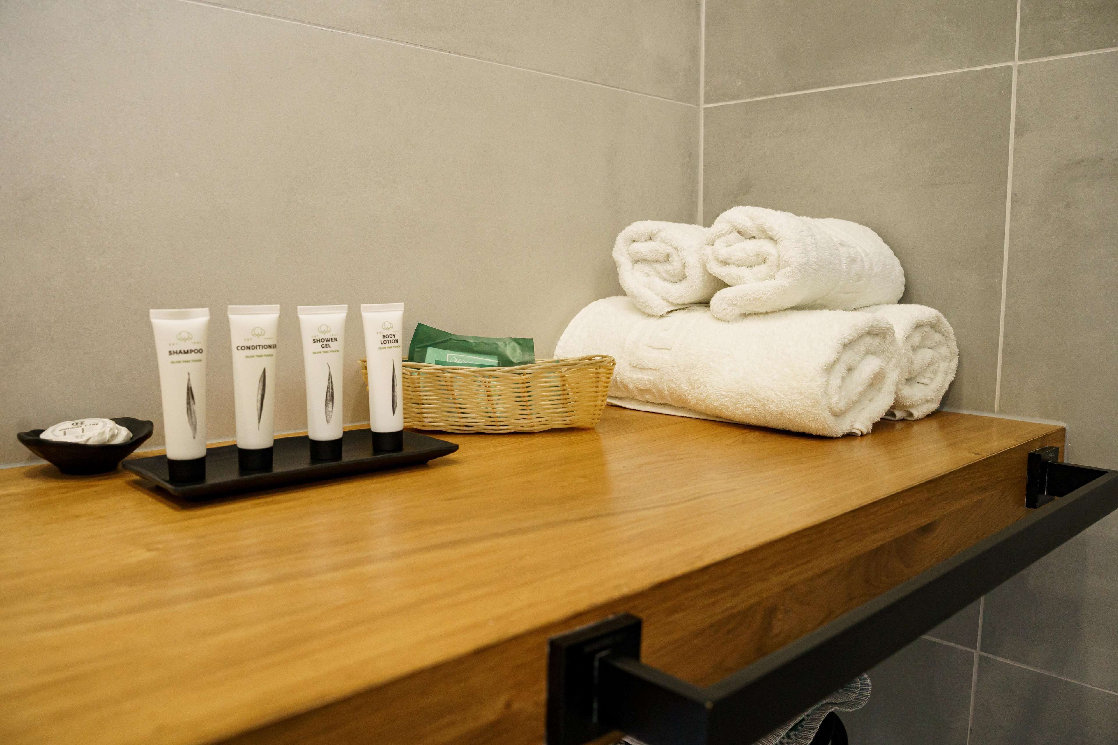 superior room | bathroom | designer toiletries, hair dryer, towels, soap