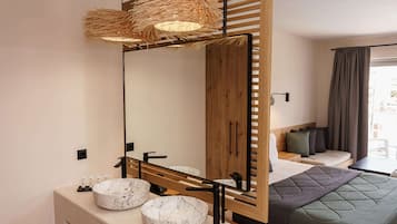 Deluxe Room with Pool View | Bathroom | Designer toiletries, hair dryer, towels, soap