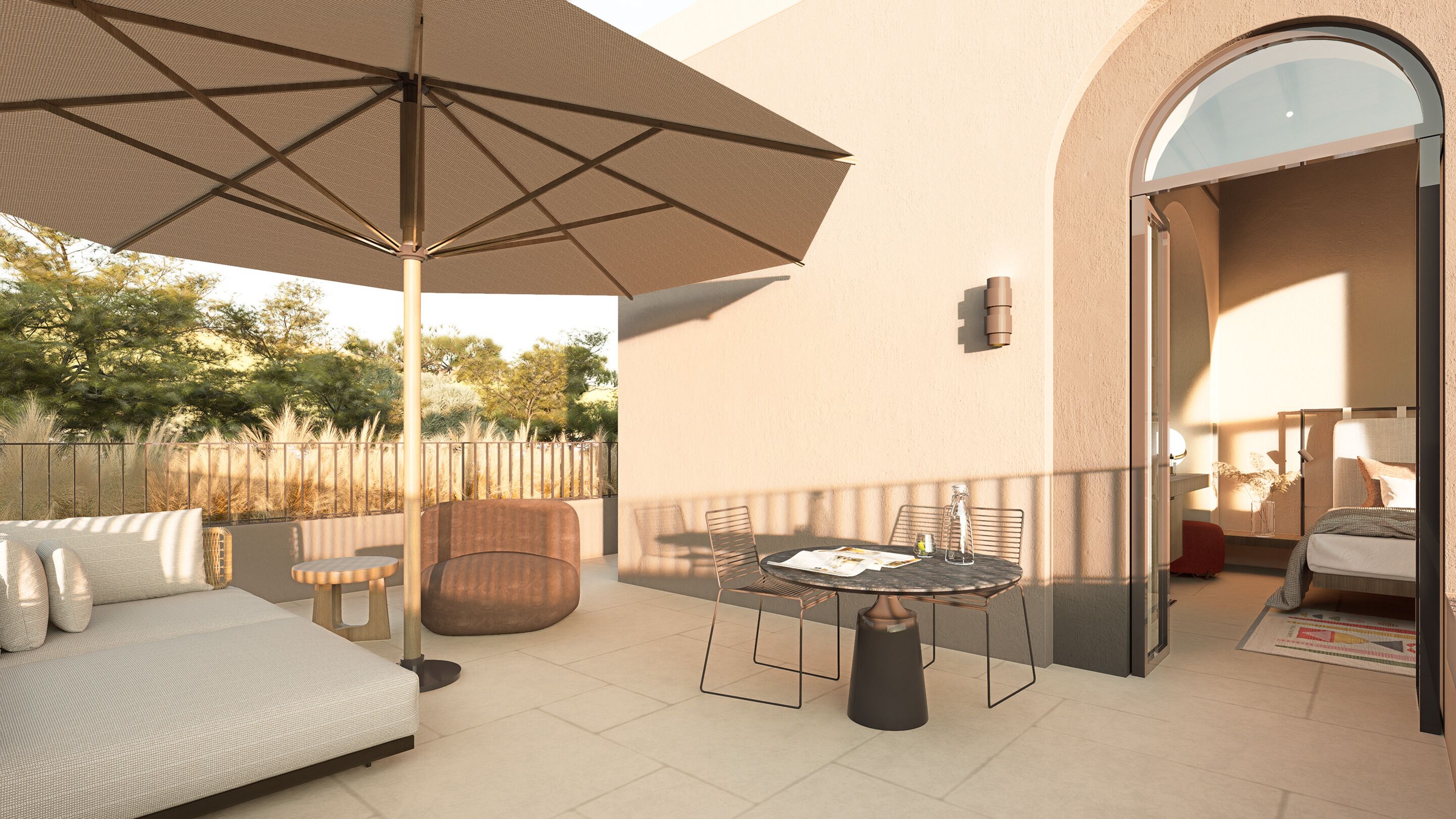 A balcony with a sofa, a table, chairs, and an umbrella.