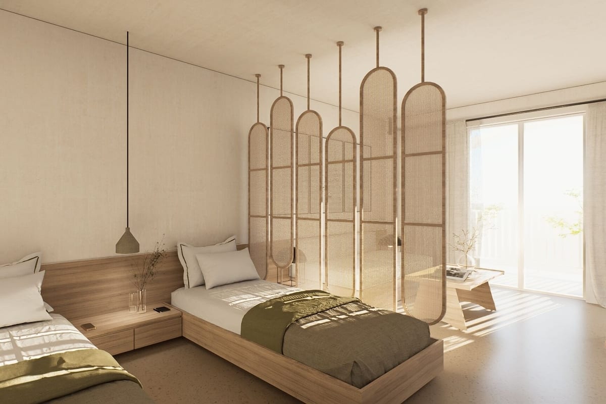 A modern bedroom with a large bed, bedside tables, a hanging light, and a large window.
