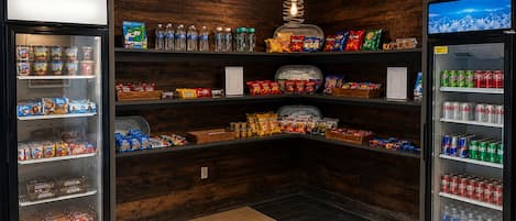 A vending area with snack and drink options, including chips, cookies, and bottled water.