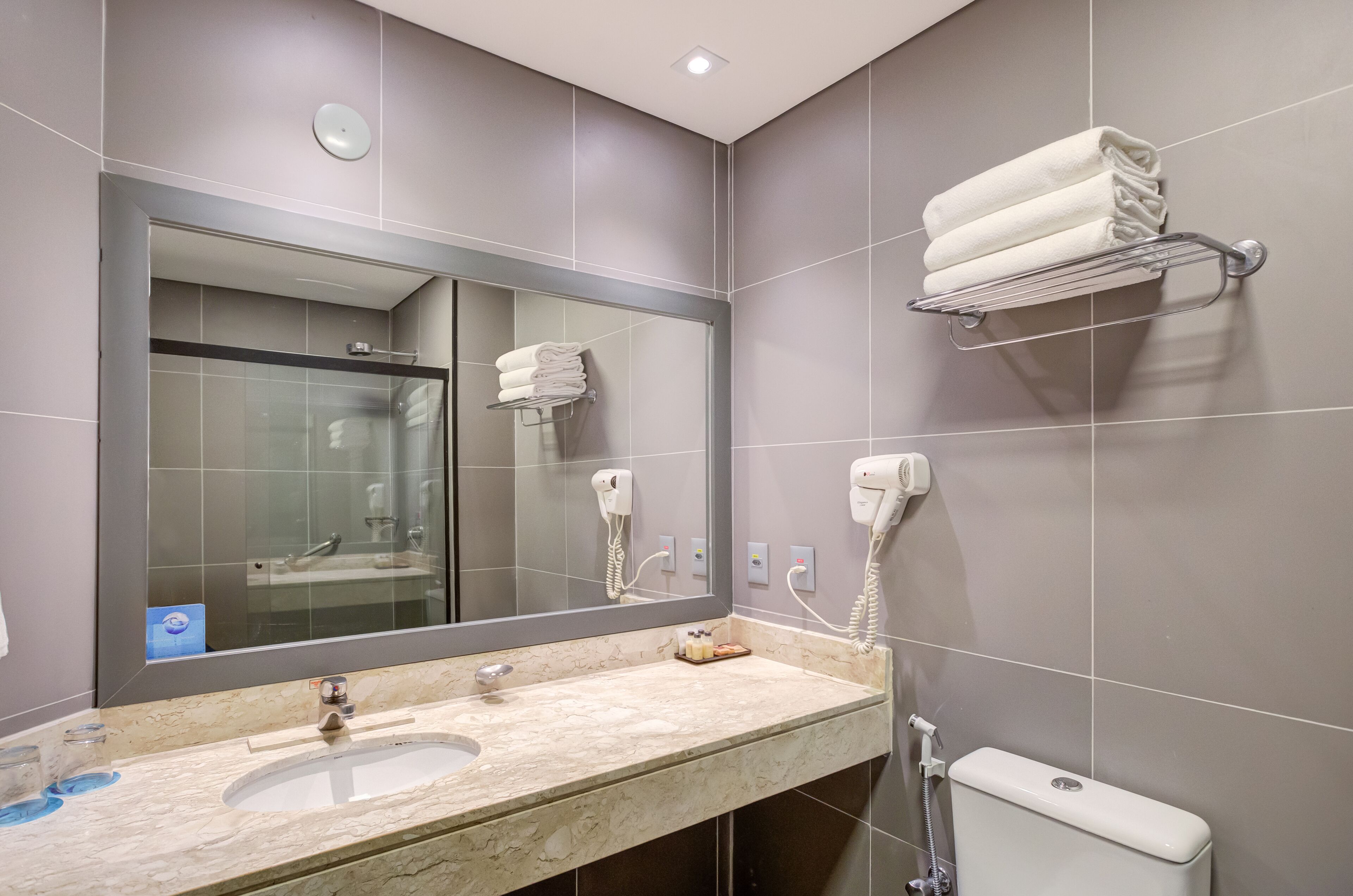 superior triple room | bathroom | shower, hair dryer, towels