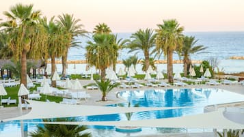 Indoor pool, outdoor pool, open 10:00 AM to 6:00 PM, pool umbrellas