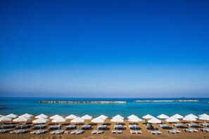 On the beach, sun loungers, beach umbrellas, beach towels - Venus Beach Hotel (Paphos)
