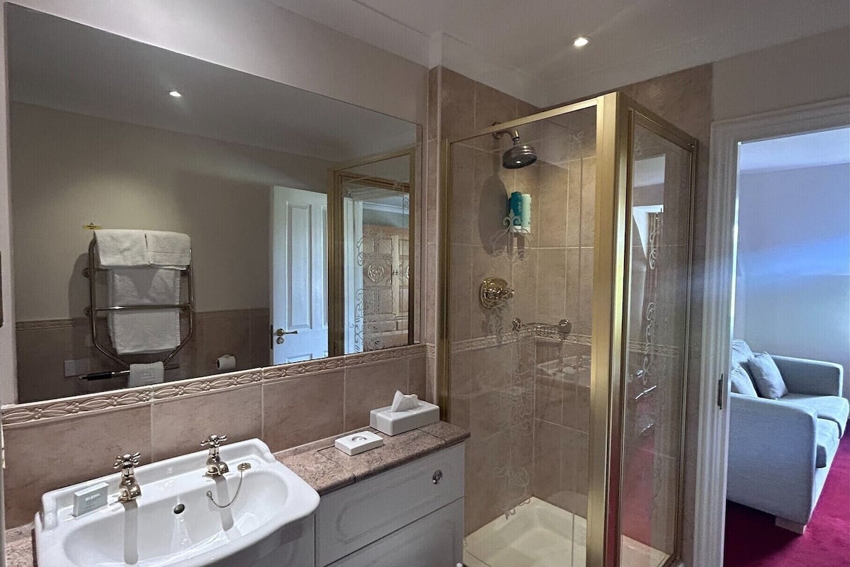 superior suite | bathroom | free toiletries, hair dryer, towels, toilet paper