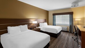 A hotel room with two beds, a desk, a chair, a window with curtains, and a ceiling light. - Best Western Rose Quartz Inn (Chester)