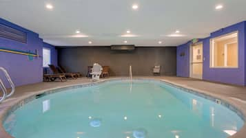 Indoor pool, open 10:00 AM to 10:00 PM, pool loungers