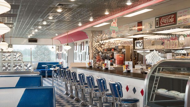 A diner with booths, a counter, and a jukebox.
