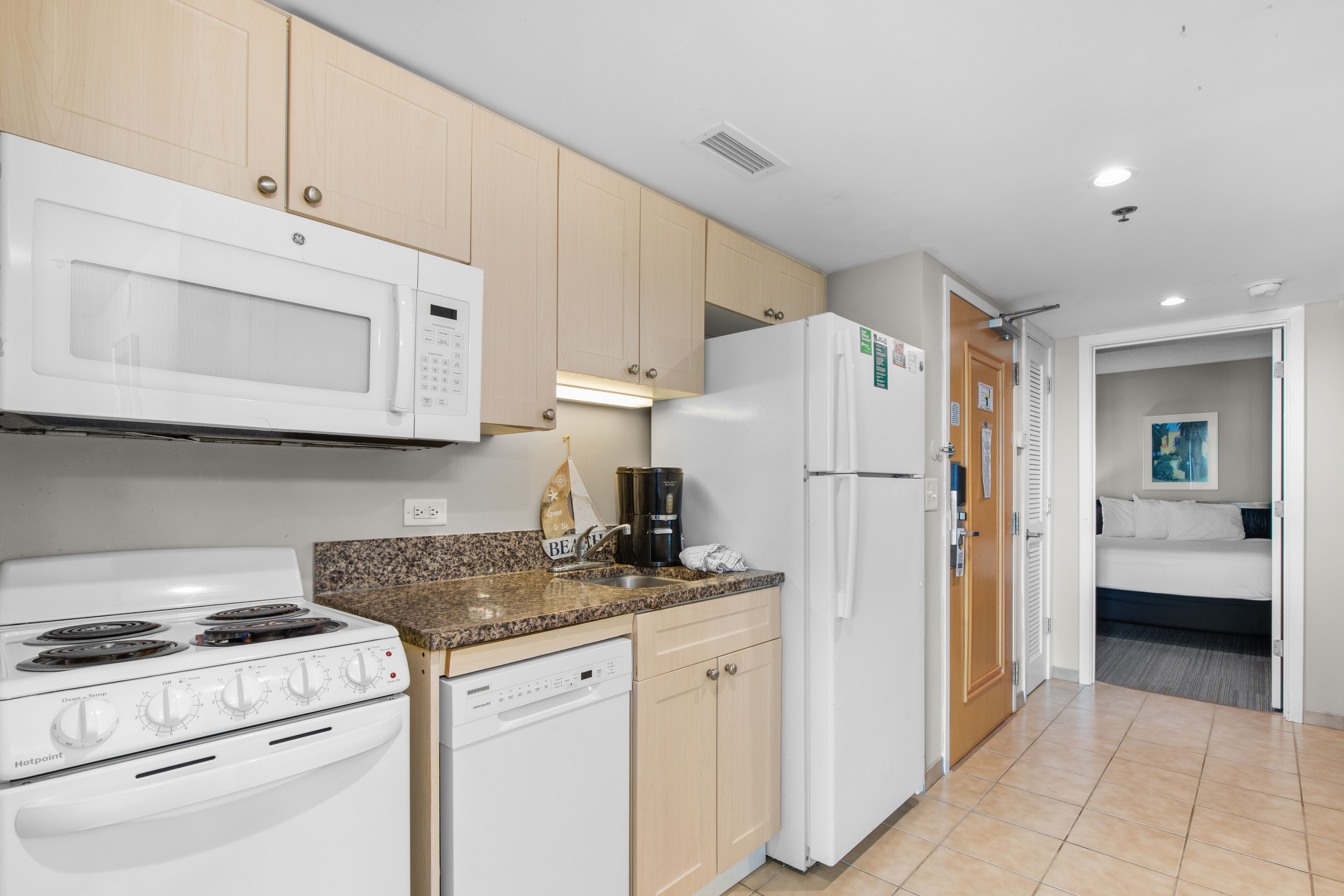standard condo, 2 bedrooms, partial ocean view | private kitchen | full-sized fridge, microwave, oven, stovetop