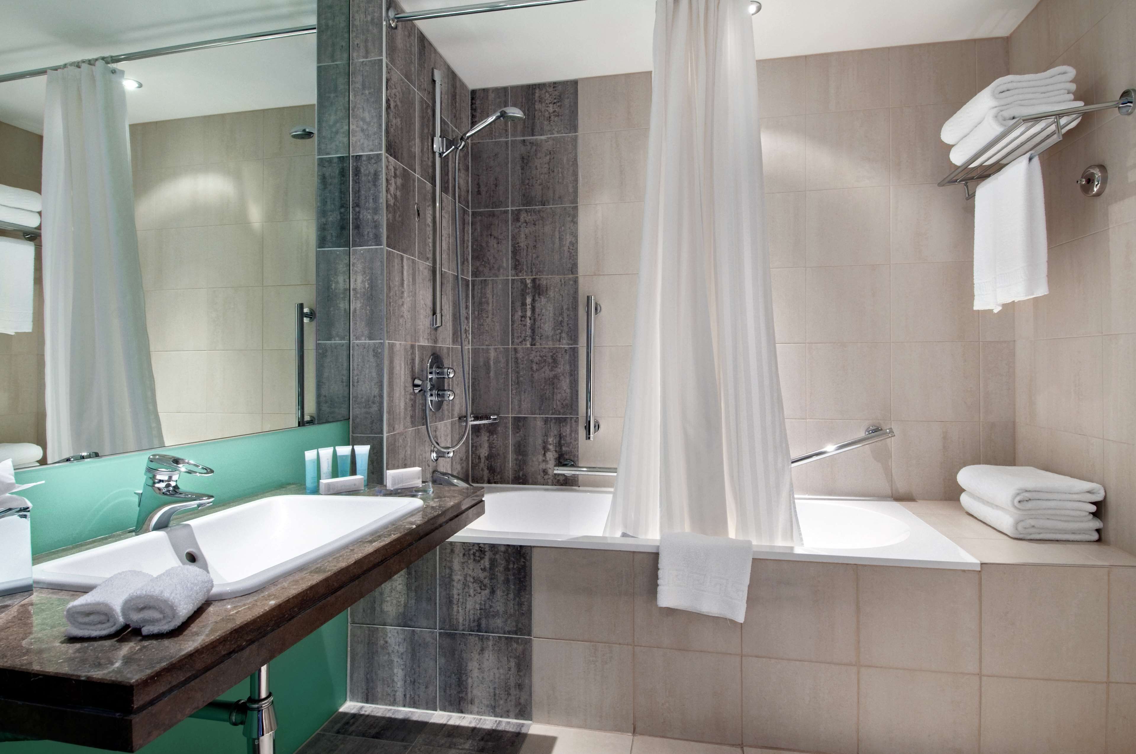 combined shower/bathtub, free toiletries, hair dryer, towels