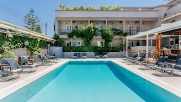 Seasonal outdoor pool, open 9:00 AM to 6:00 PM, pool umbrellas