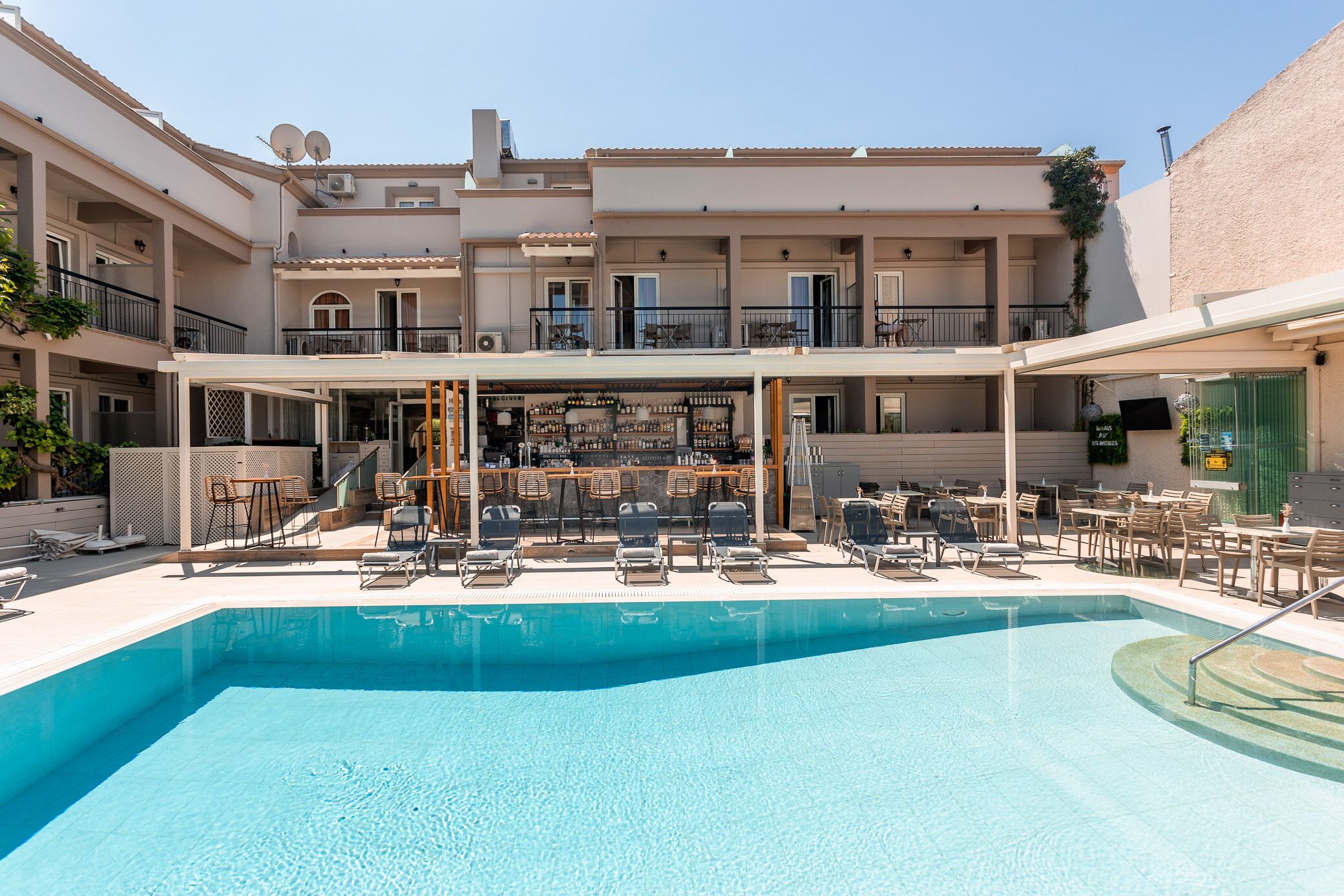 seasonal outdoor pool, open 9:00 am to 6:00 pm, pool umbrellas