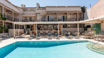 Seasonal outdoor pool, open 9:00 AM to 6:00 PM, pool umbrellas